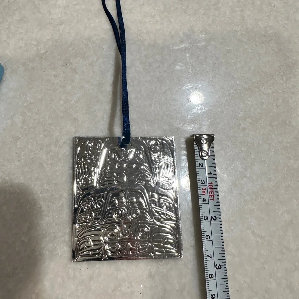 Set of two vintage silver plated Native American Christmas ornaments